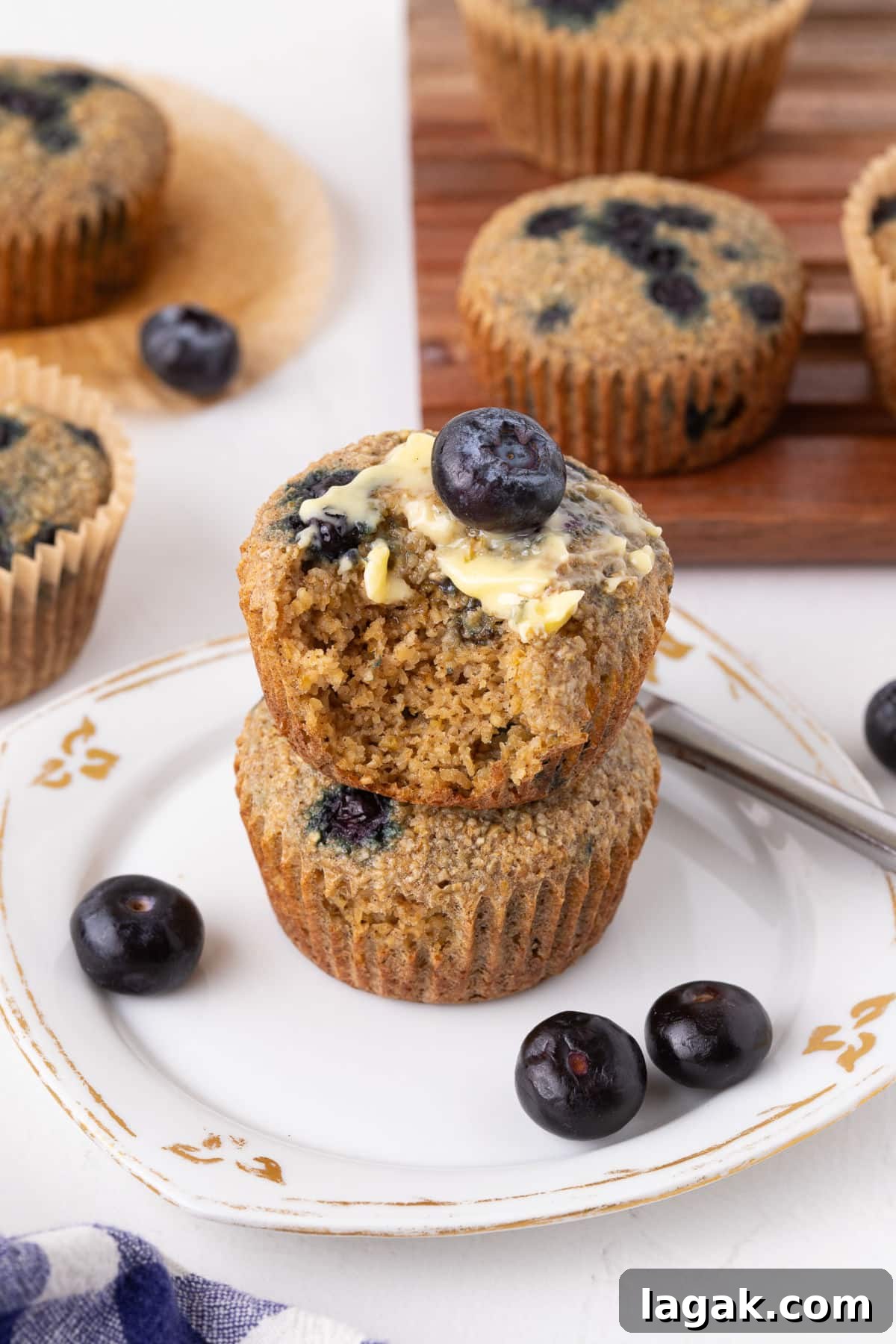 Blueberry Oat Bran Muffins — Flourless, Sugar-Free Recipe 2 Stack of two blueberry oat bran muffins.