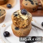 Blueberry Oat Bran Muffins — Flourless, Sugar-Free Recipe 8 Stack of two blueberry oat bran muffins.