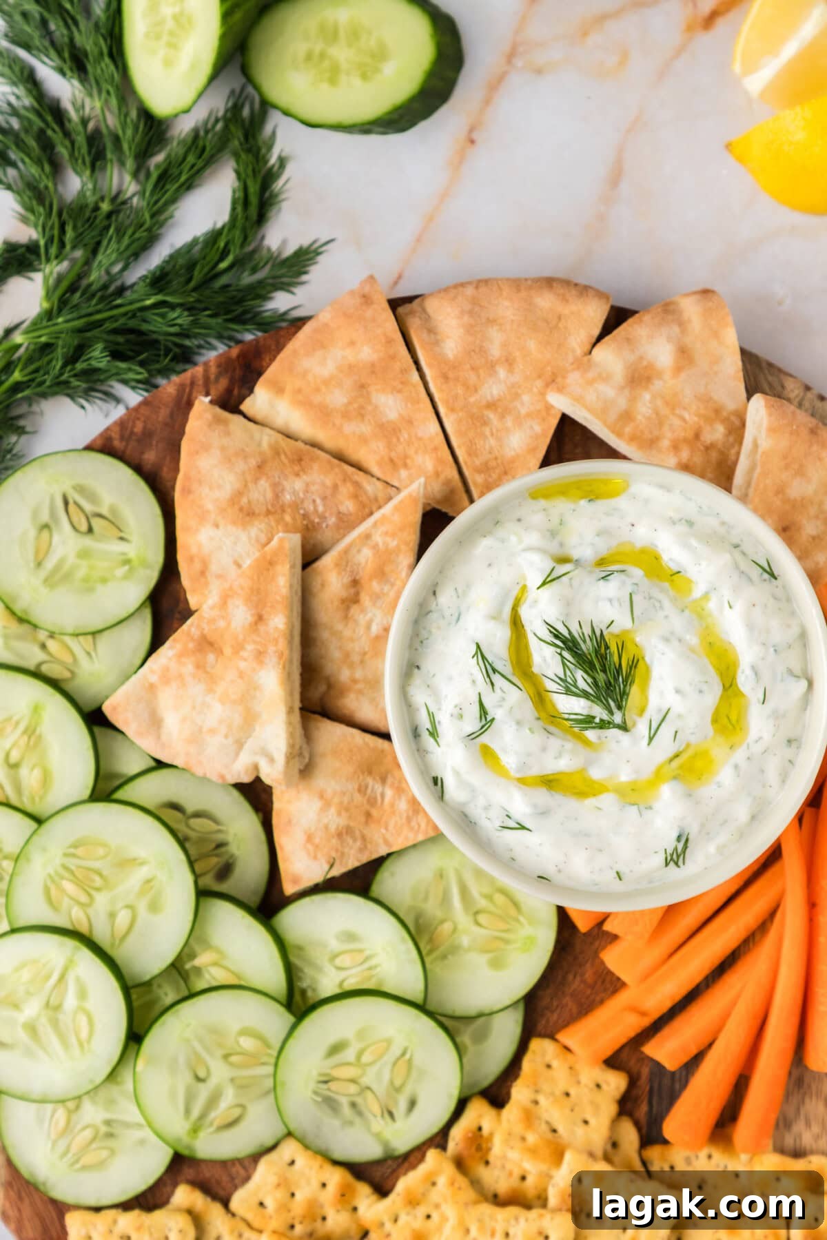 Authentic Greek Tzatziki Sauce Recipe — Creamy Cucumber Yogurt Dip 5 Close up photo of a bowl of Tzatziki Sauce topped with olive oil