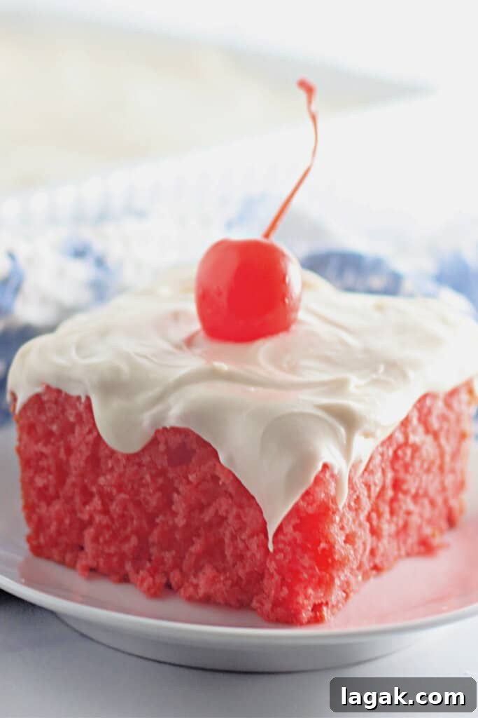 Moist Maraschino Cherry Cake Recipe with Cherry Glaze 2 Slice of maraschino cherry cake on a plate.