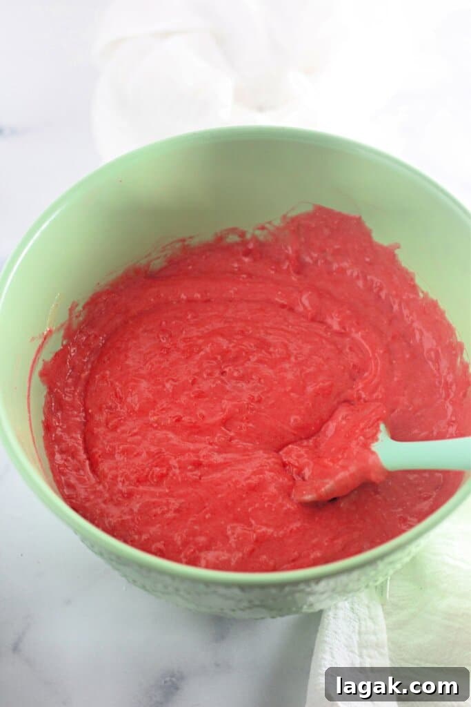 Moist Maraschino Cherry Cake Recipe with Cherry Glaze 7 Batter being mixed in a large bowl.