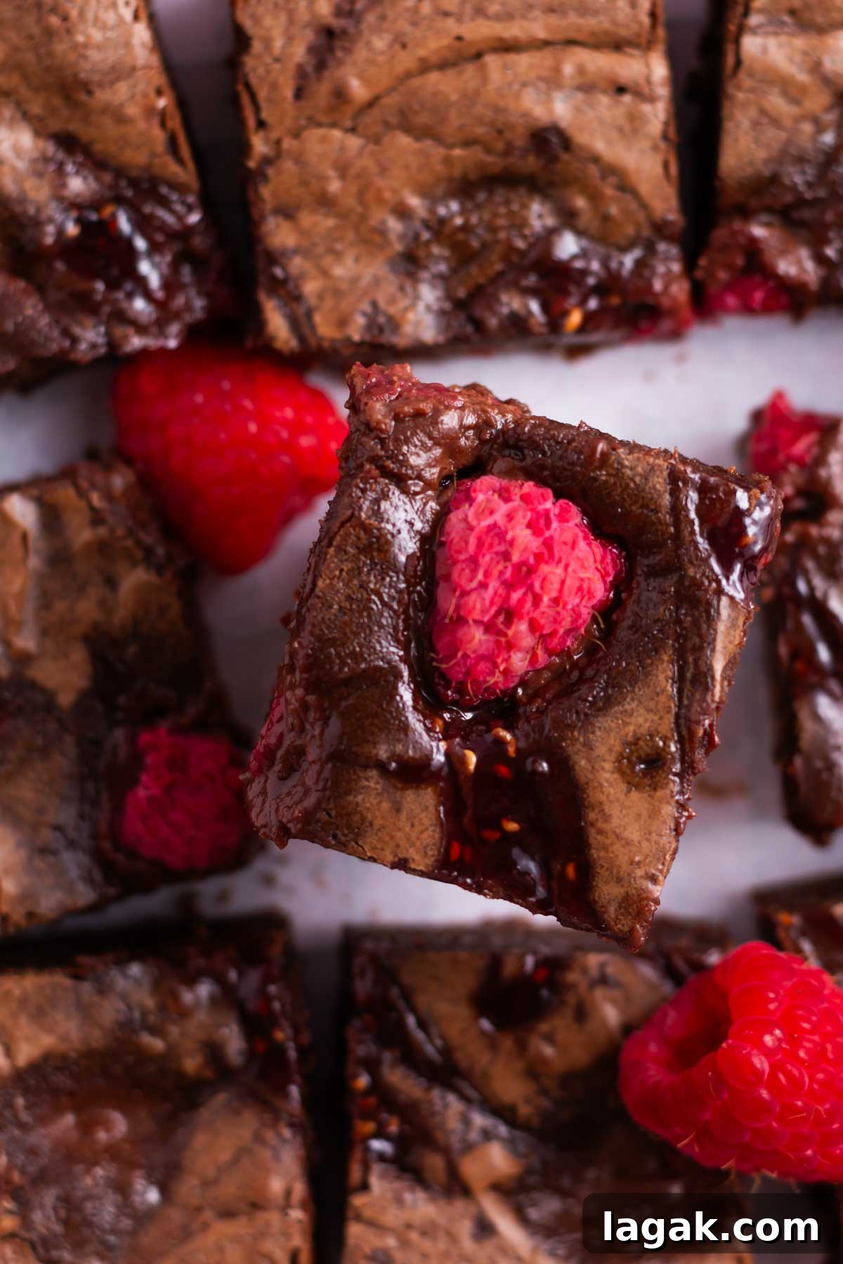 raspberry swirled brownie with a raspberry on top