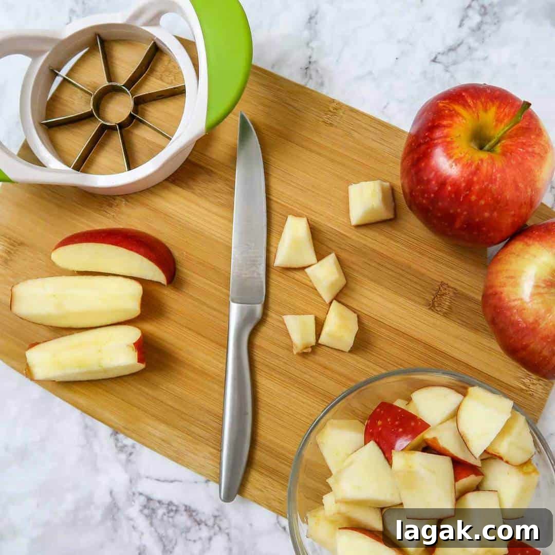 Slow Cooker Butternut Squash with Apples and Warm Spices 4 Overhead view of first process shot- slicing apples into small cubes.