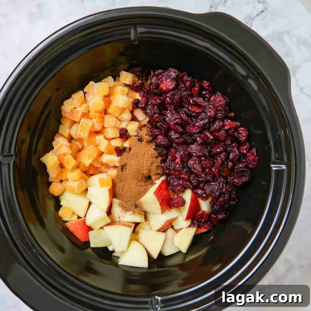 Slow Cooker Butternut Squash with Apples and Warm Spices 5 Overhead shot of all ingredients layered in the crock pot.