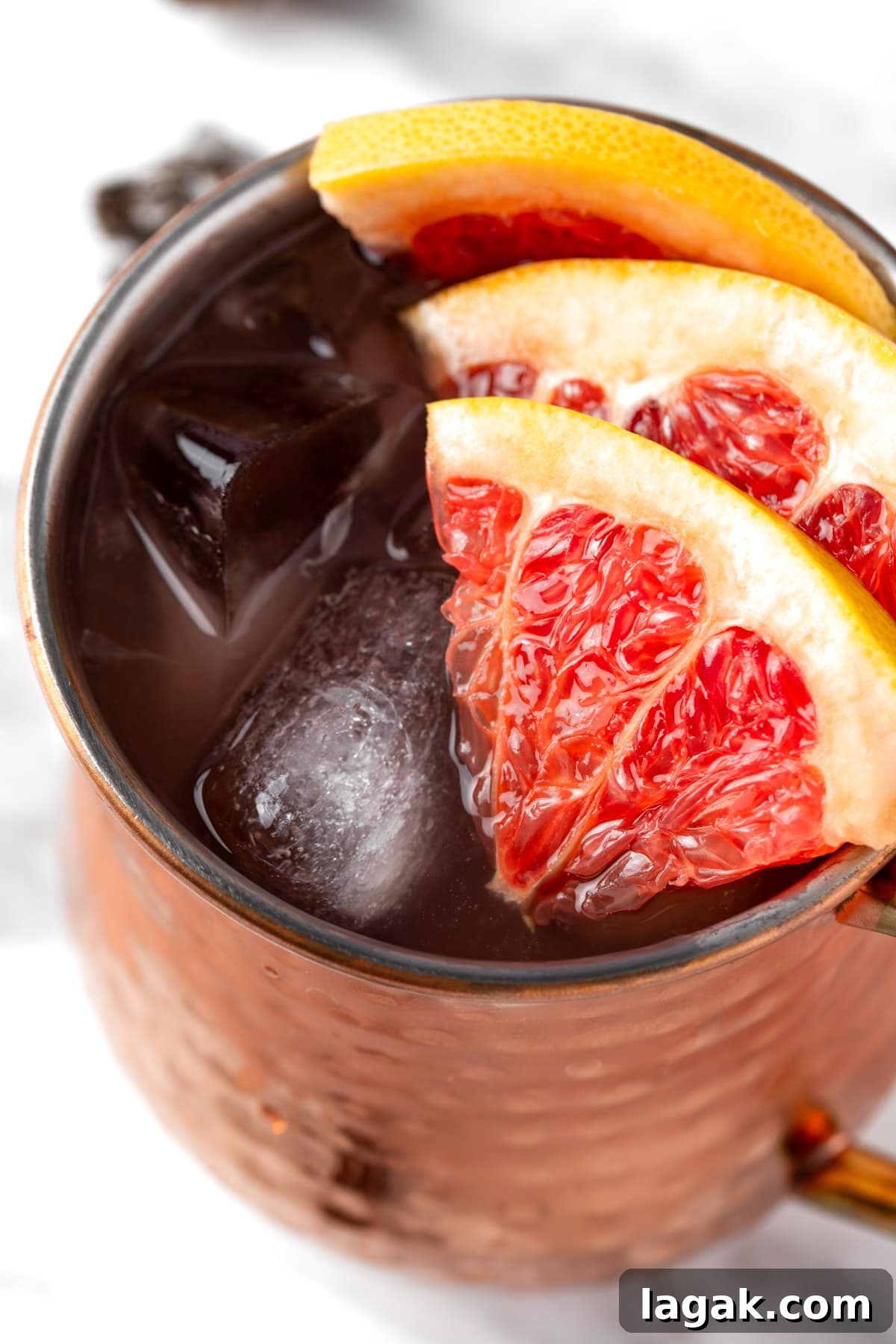 A grapefruit moscow mule garnished with grapefruit slices.