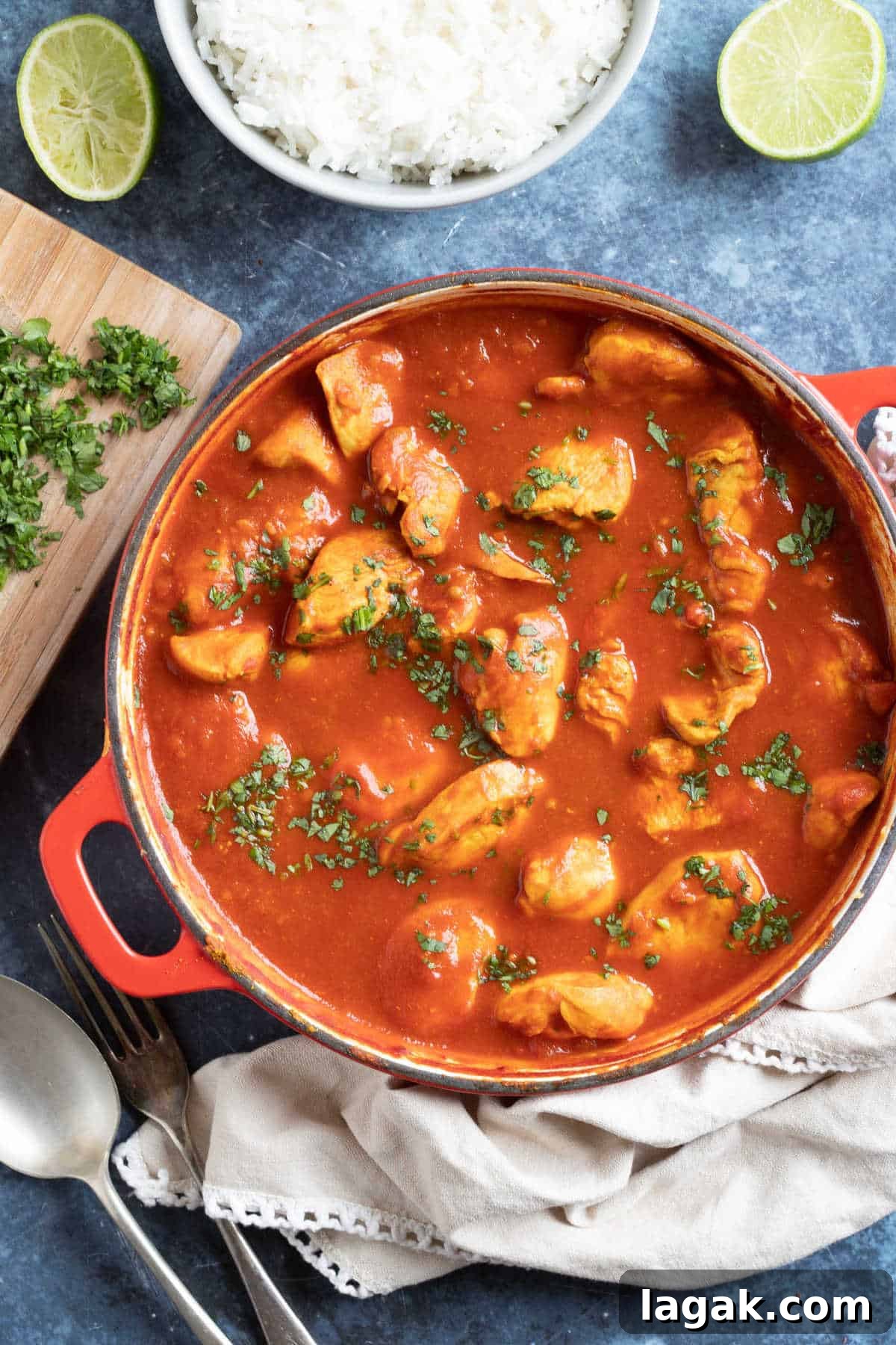 Authentic Chicken Pathia Curry Recipe — Tangy Spiced Chicken 5 Chicken pathia curry in a red pan.