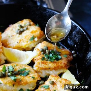 Pan-Seared Cod with Classic Meunière Sauce 7 Pan Fried Cod in a cast iron skillet with Meuniere Sauce spooned over