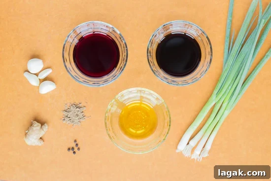Asian-Inspired Gluten-Free Steak Marinade Recipe for Bold Flavor 3 Ingredients for gluten free flank steak marinade on a cutting board.