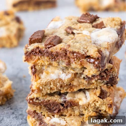 s'more cookie bars stacked featured image