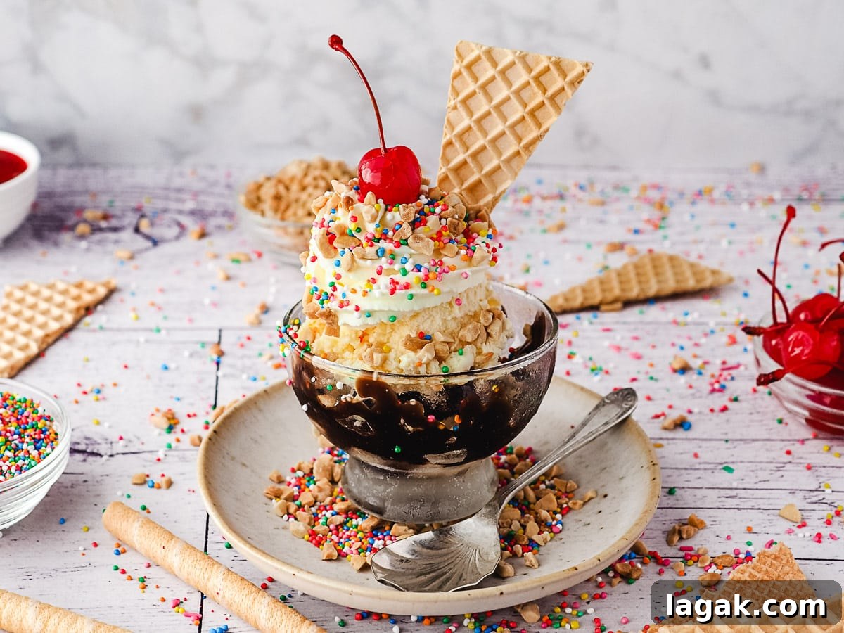 Classic sundaes in a cup, surrounded by sprinkles, wafers, spoons, nuts and maraschino cherries.