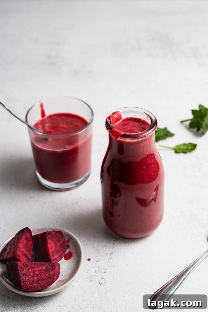 Top Vegetables to Add to Your Smoothies for Flavor & Nutrition 5 Beet smoothie in a jar with another small glass behind it and a small dish of chopped beets beside it.