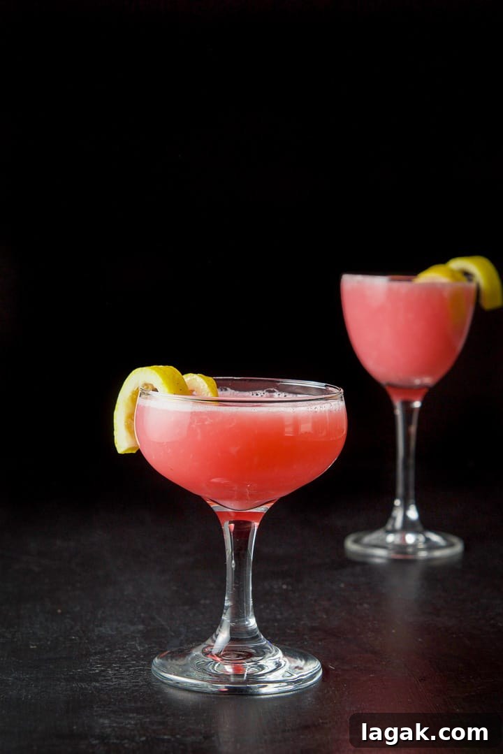 Pink Lady Cocktail Recipe: Classic Gin & Apple Cider Drink 10 Vertical view of the pink cocktail both in the coupe glass and martini glass