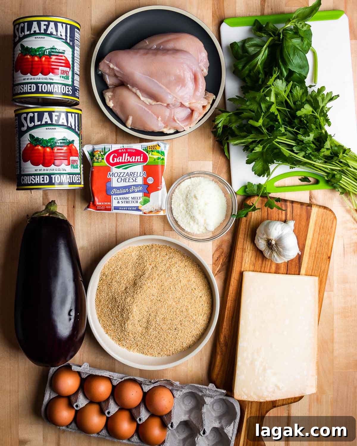 Chicken and Eggplant Parmesan Recipe: Crispy Baked Italian Casserole 4 Ingredients shown: tomatoes, chicken, basil, parsley, cheeses, garlic, breadcrumbs, eggplant, and eggs.