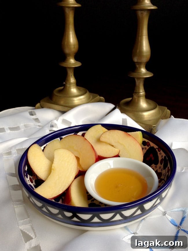 Ginger-Cinnamon Olive Oil Pear Cake Recipe 4 Apples and honey in a bowl with candlesticks in background