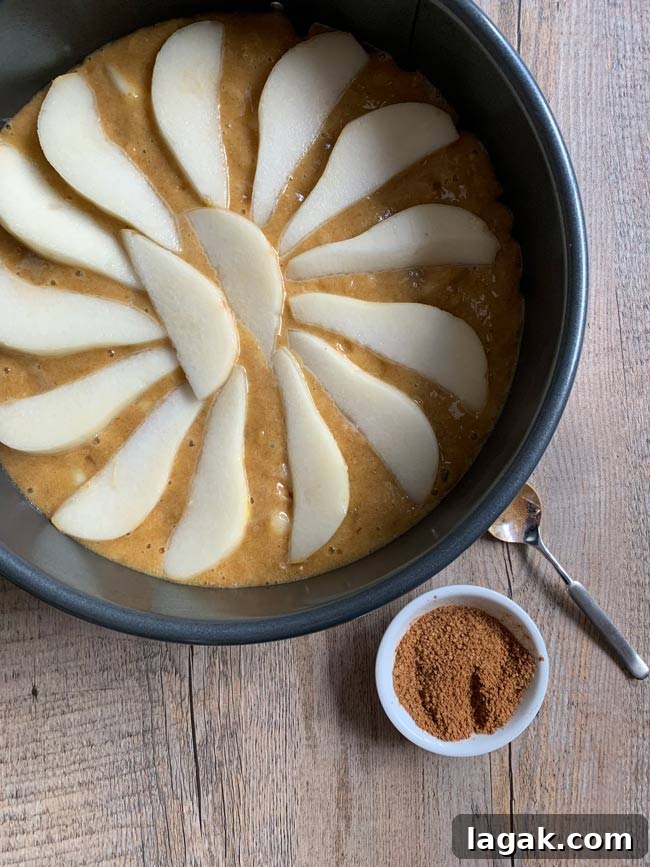 Ginger-Cinnamon Olive Oil Pear Cake Recipe 7 Pear cake batter in round pan with cinnamon sugar, ready to go into the oven.
