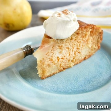 Ginger-Cinnamon Olive Oil Pear Cake Recipe 10 close up cake slice with whipped cream fork on plate