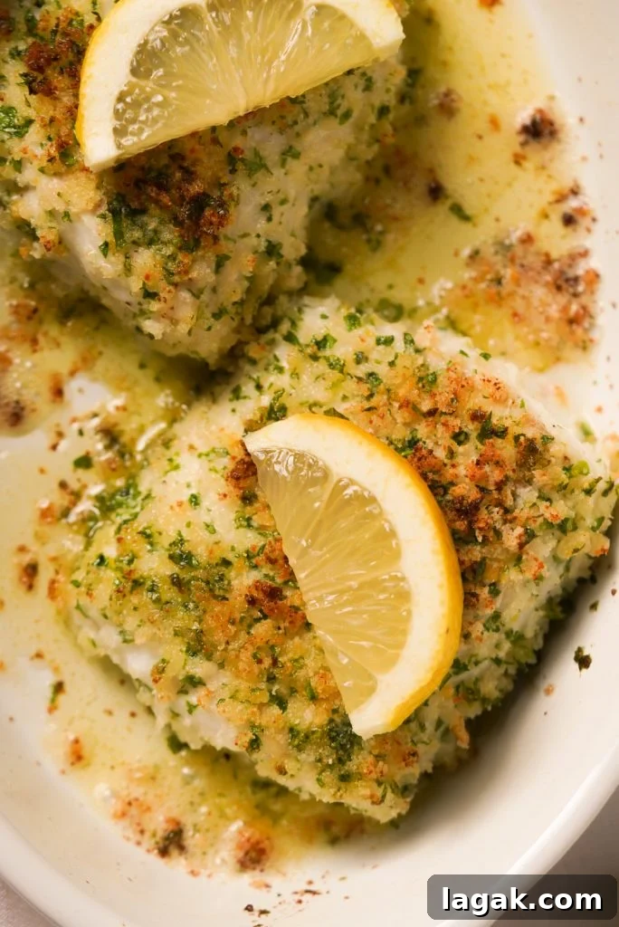 crusted cod fillets with lemon wedges