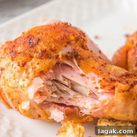 Smoked Chicken Quarters Recipe: Juicy, Crispy Skin Techniques 11 Photo of a smoked chicken leg quarter with bite taken out that looks tender, moist and juicy.