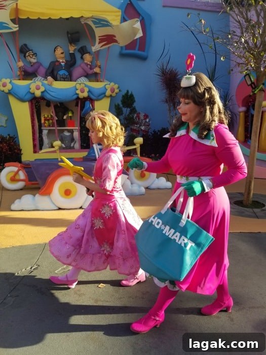 Universal Orlando Holiday Events and Seasonal Attractions 2026 7 Pink Who from Whoville walking around the village