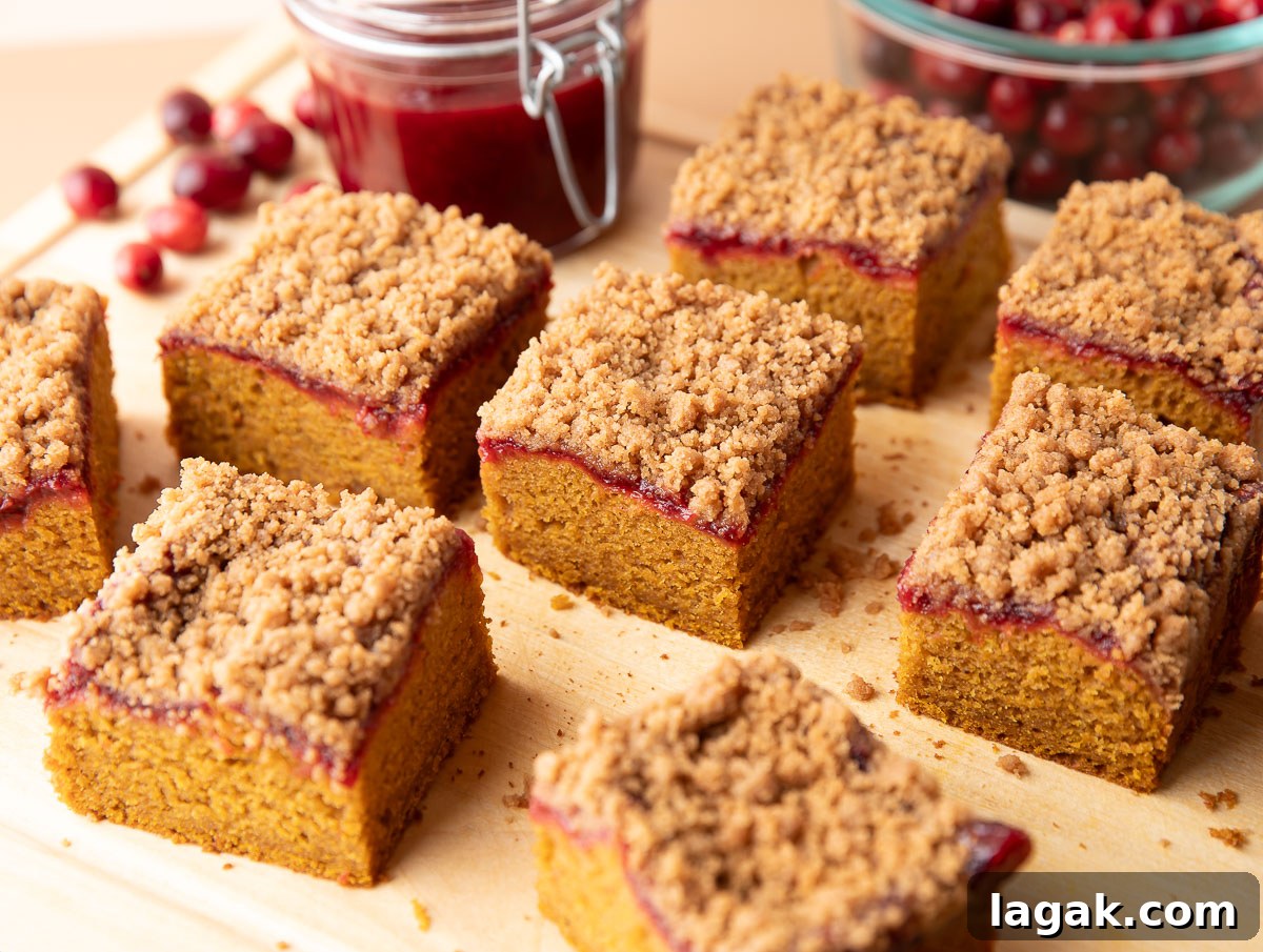 Fluffy Pumpkin Cranberry Coffee Cake slices with cranberry sauce and streusel on top