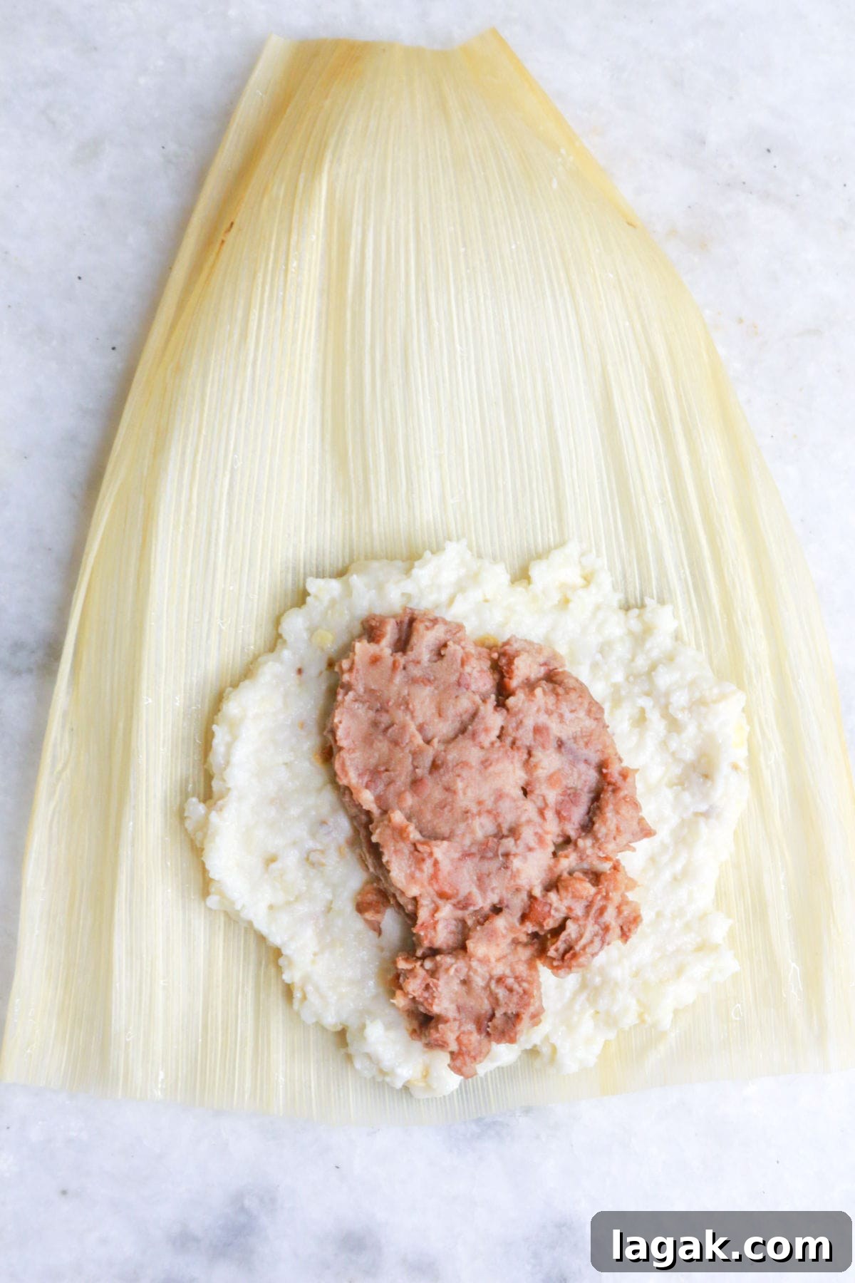Refried Bean Tamales Recipe – Authentic Mexican Tamales 9 Corn husk with masa and beans