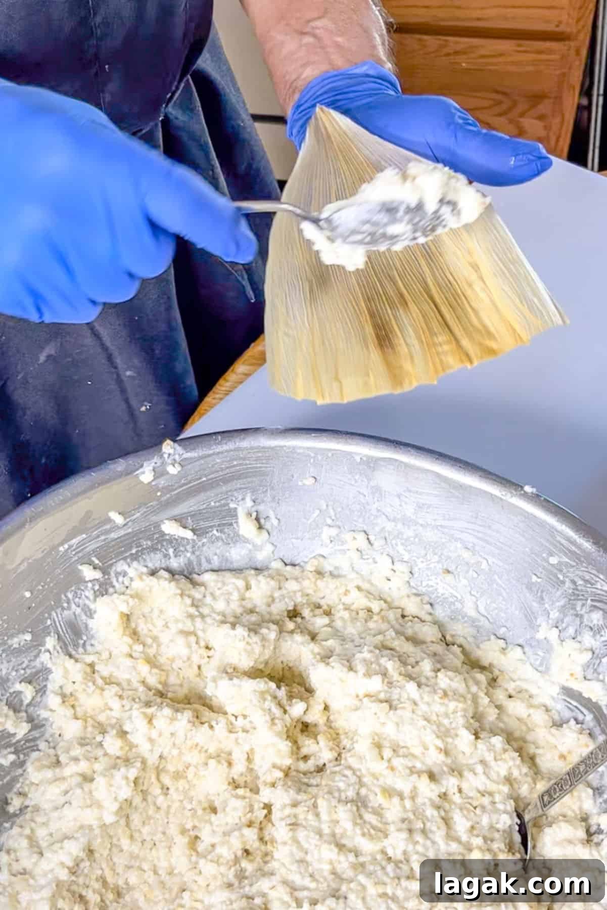 Refried Bean Tamales Recipe – Authentic Mexican Tamales 7 Holding a corn husk