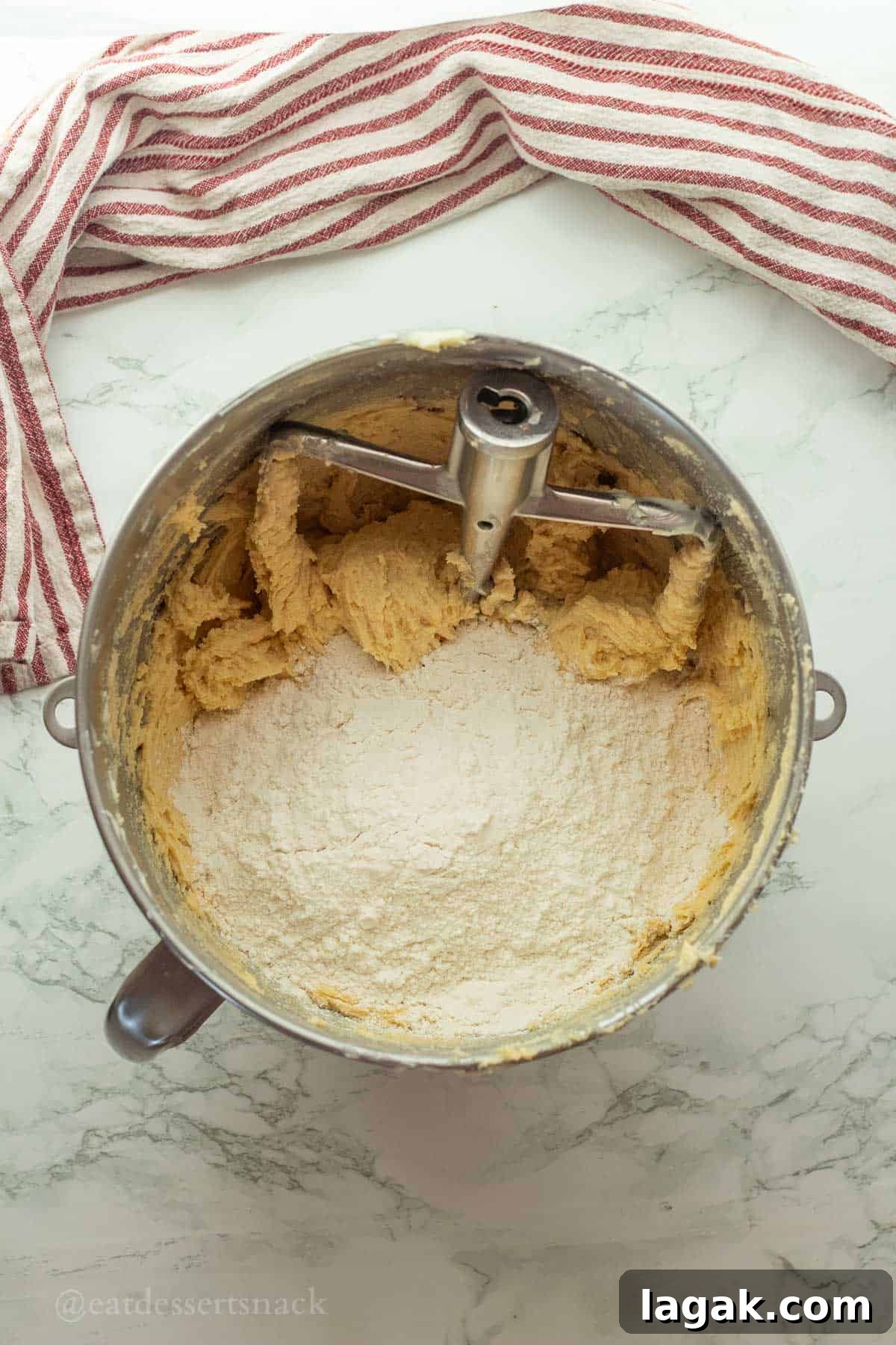 Extra-Soft Vanilla Pudding Chocolate Chip Cookies 7 Flour in raw cookie dough in mixing bowl.