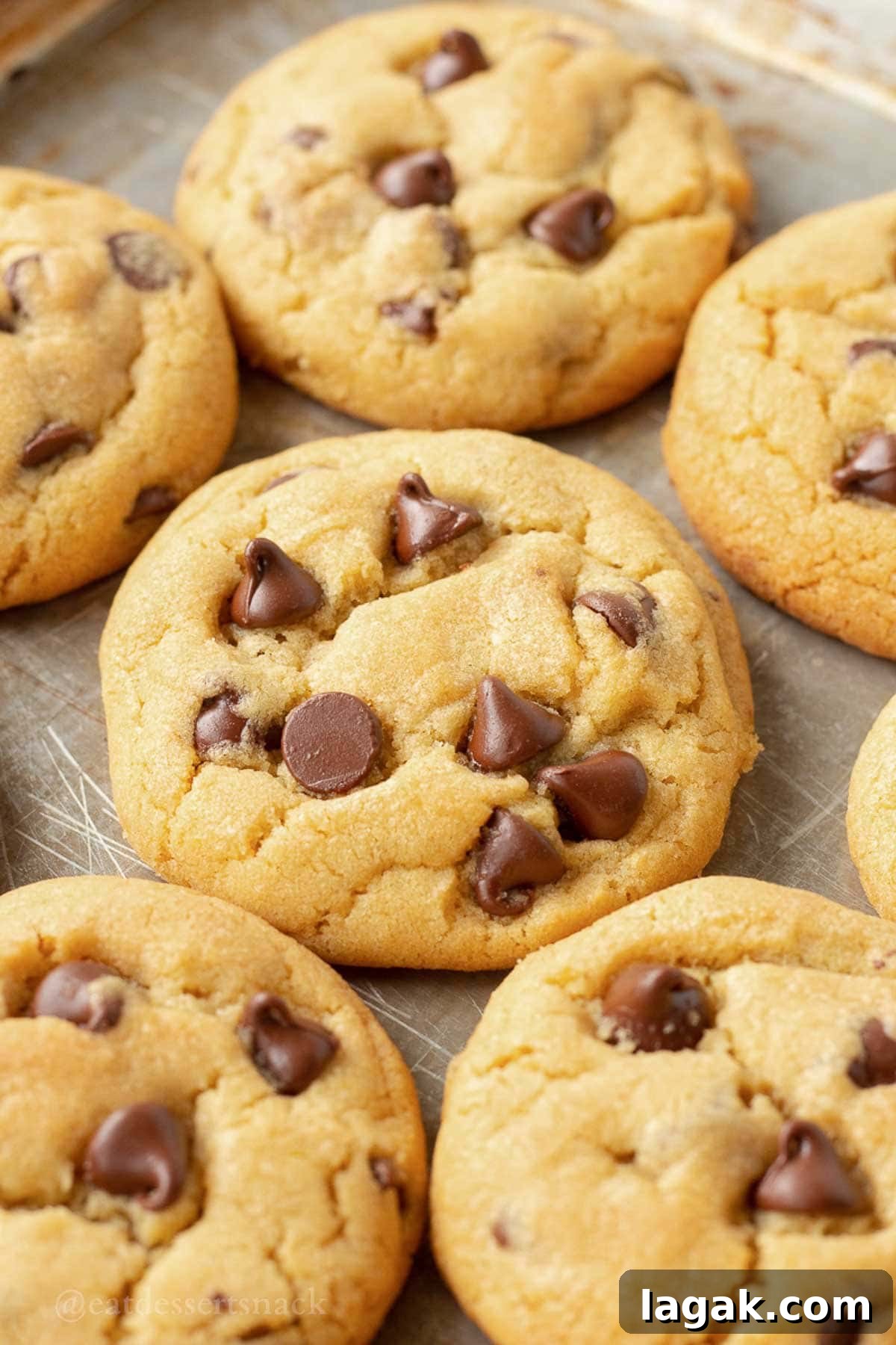 Extra-Soft Vanilla Pudding Chocolate Chip Cookies 9 Baked cookies on baking sheet.