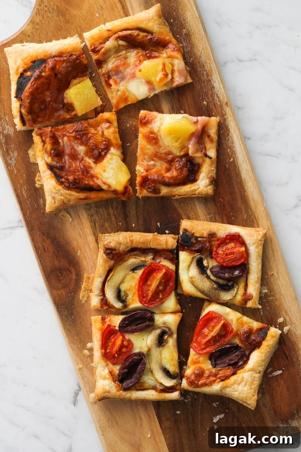 Crispy Puff Pastry Pizza Recipe — Quick Homemade Pizzas 3 sliced puff pastry pizzas on a serving board.