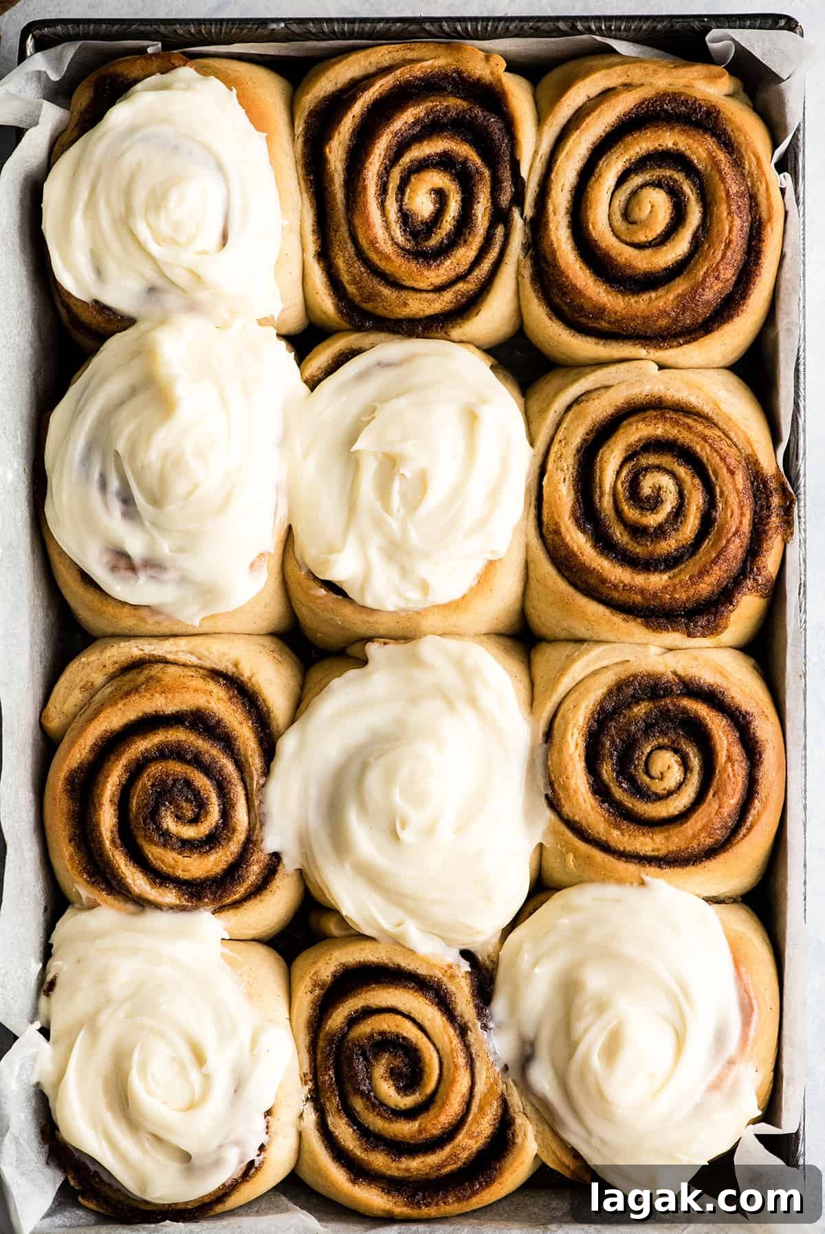 Best Homemade Cinnamon Rolls overhead view of a pan of 12 homemade cinnamon rolls with cream cheese frosting