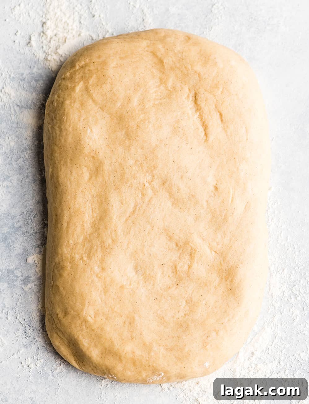 Form Dough Rectangle overhead photo of cinnamon roll dough formed into a rectangle