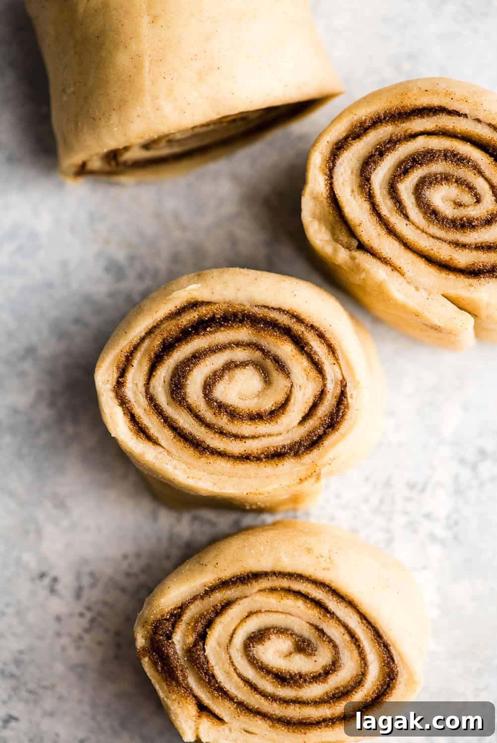 Cut Rolls overhead photo showing how to make cinnamon rolls - dough being cut into rolls