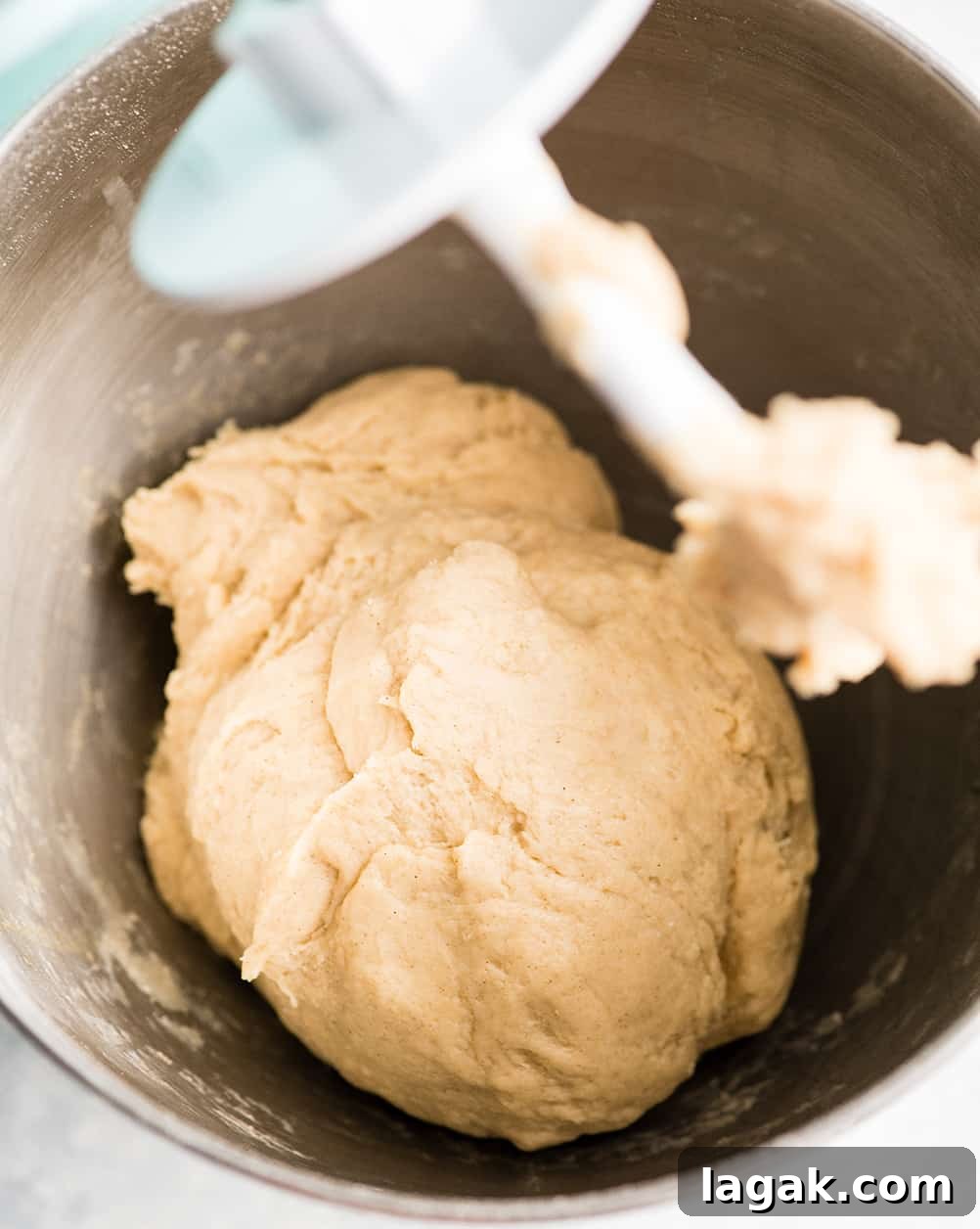 Kneading Dough overhead photo showing how to make cinnamon rolls