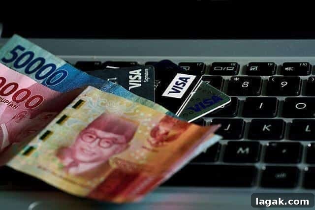 5 Smart Tips for Choosing a Credit Card After a Major Life Change 3 Money on a laptop keyboard, symbolizing financial decisions for