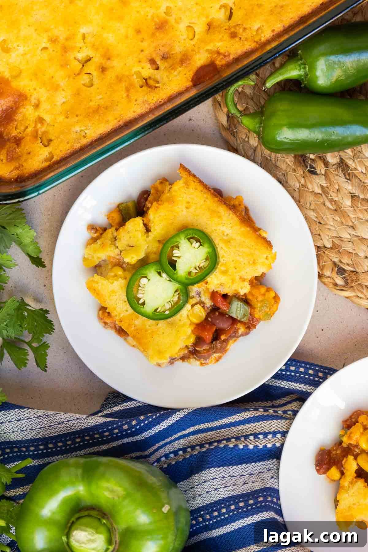 Chili cornbread casserole topped with fresh jalapeño.