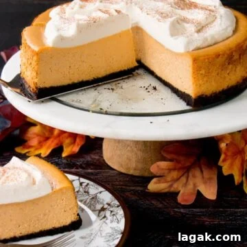 Top Apple and Pumpkin Desserts: 15 Fall Recipes to Try 10 A pumpkin cheesecake on a serving plate with a slice of cheesecake.