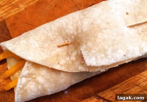 Crispy Homemade Taquitos Recipe 5 Taquito with toothpick