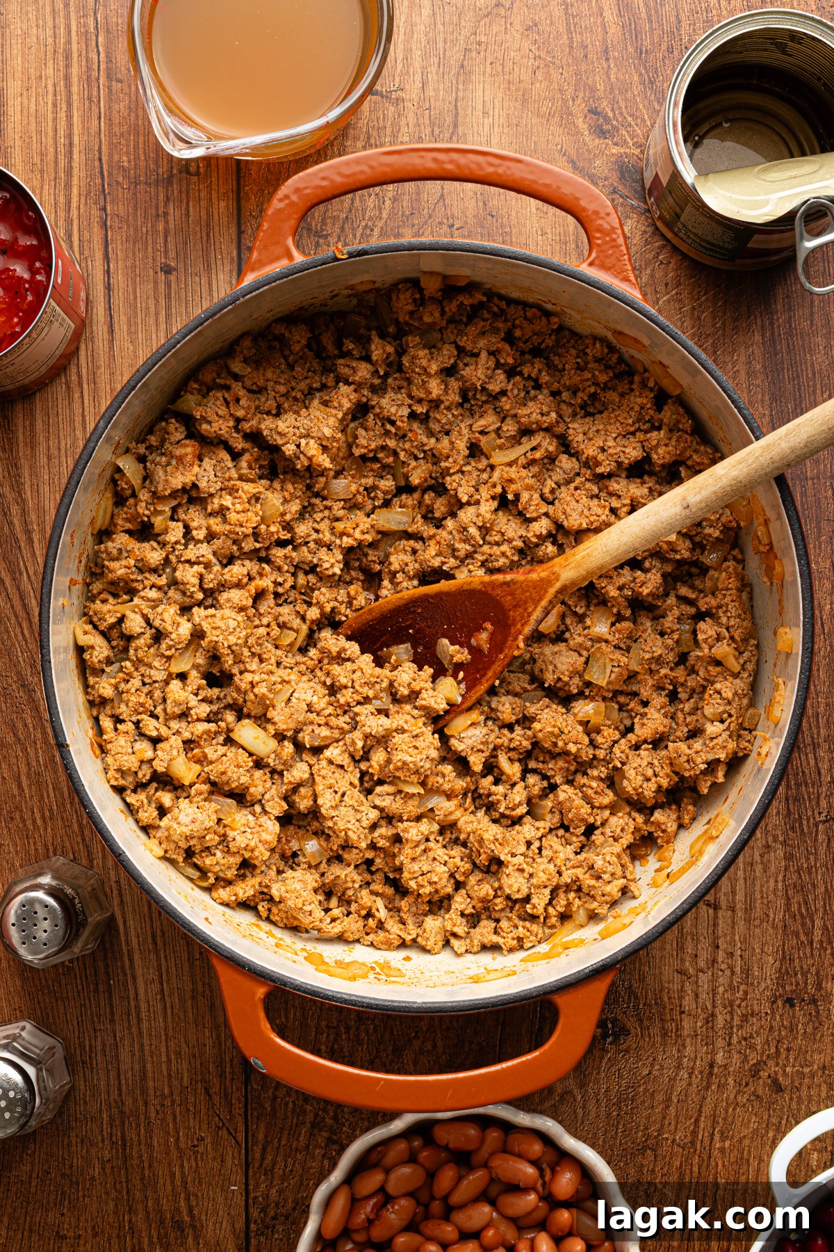 30-Minute High-Protein Turkey Chili Recipe 6 A large pot filled with sauteed ground turkey, onions and garlic