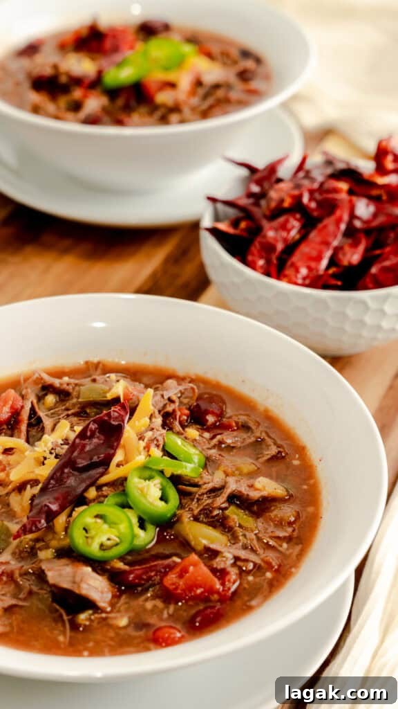 Spicy Venison Chili in the Instant Pot: Quick Pressure-Cooker Recipe 2 White bowl filled with Instant Pot Spicy Venison Chili.