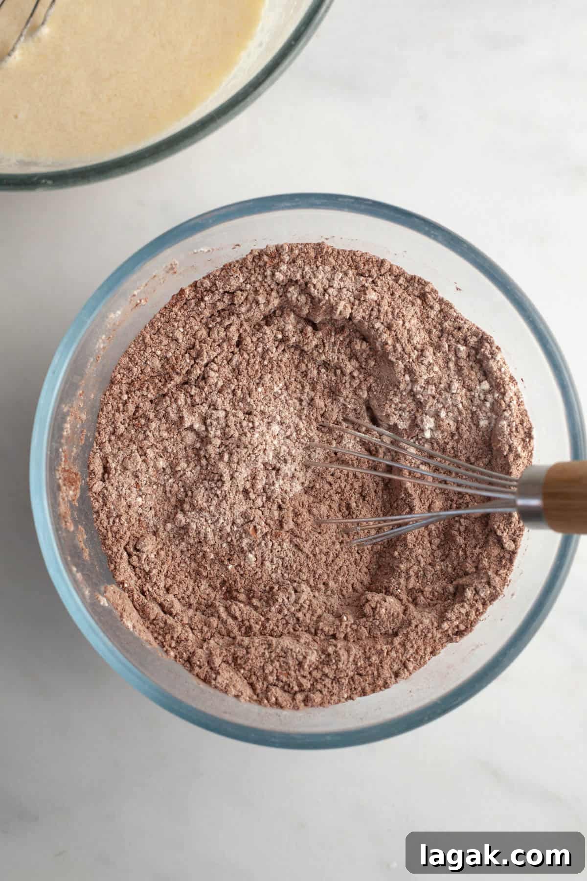 Moist Chocolate Cupcakes with Cream Cheese Frosting Recipe 4 Cocoa powder and flour in a bowl.