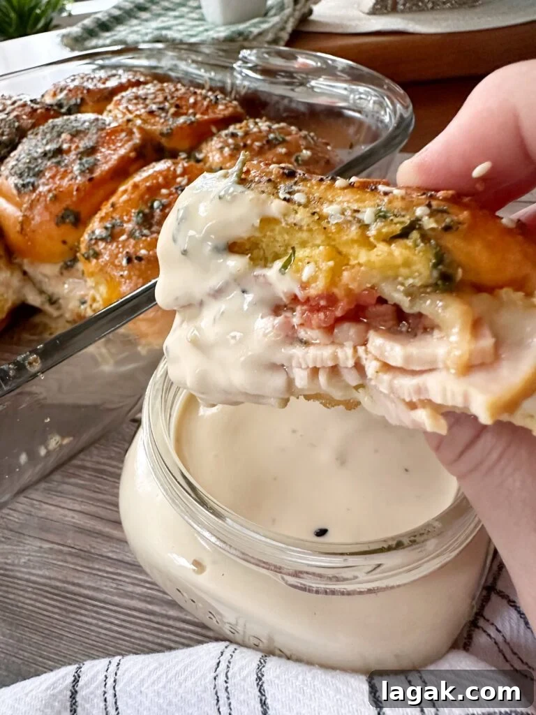 Derby Day Hot Brown Sliders Recipe for Kentucky Party Bites 11 A hot brown slider dipped in white sauce