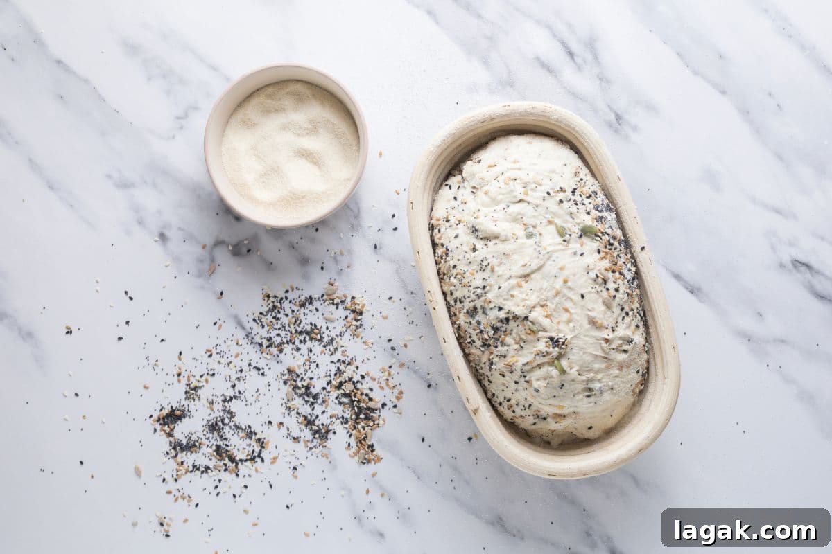 Multigrain Sourdough Bread: Step-by-Step Artisan Recipe 9 Multigrain sourdough bread dough in banneton ready for cold ferment.