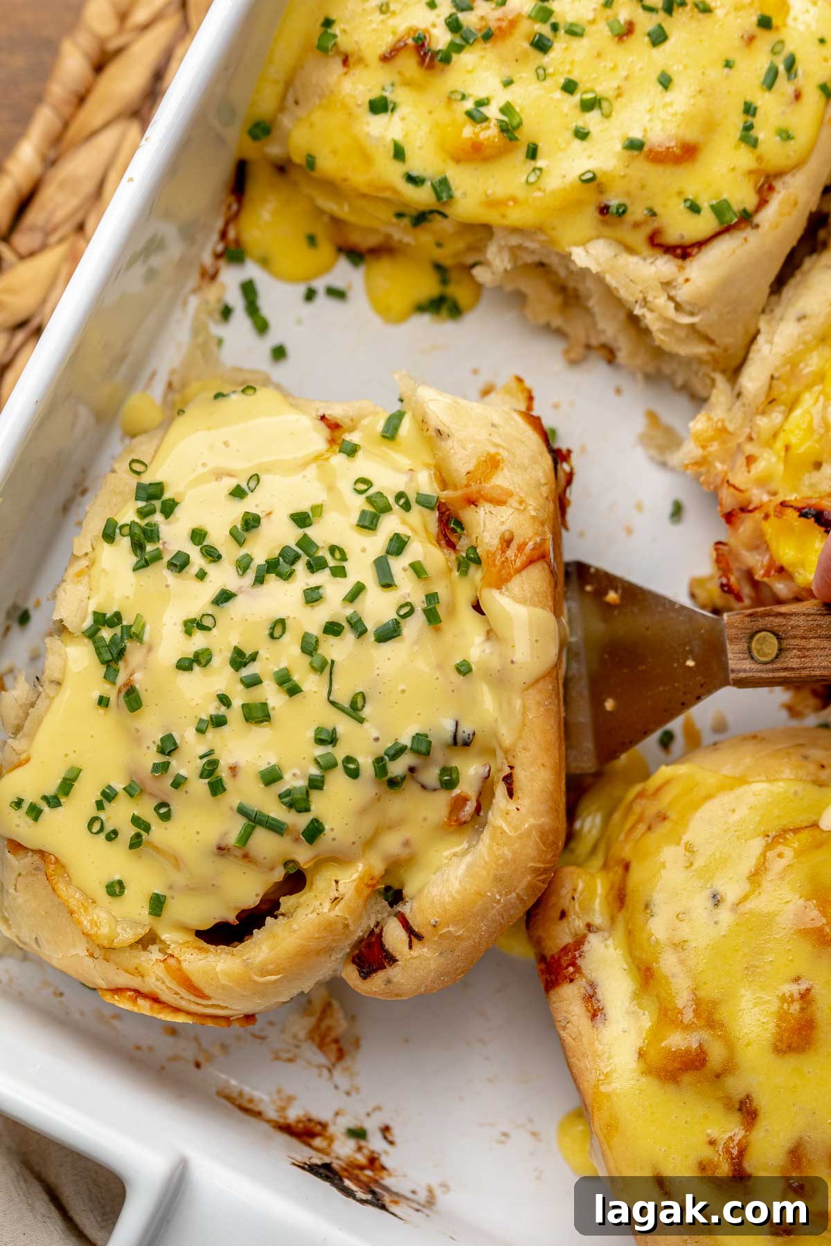 Savory Breakfast Rolls with Creamy Hollandaise Sauce 2 Savory breakfast rolls in a baking dish