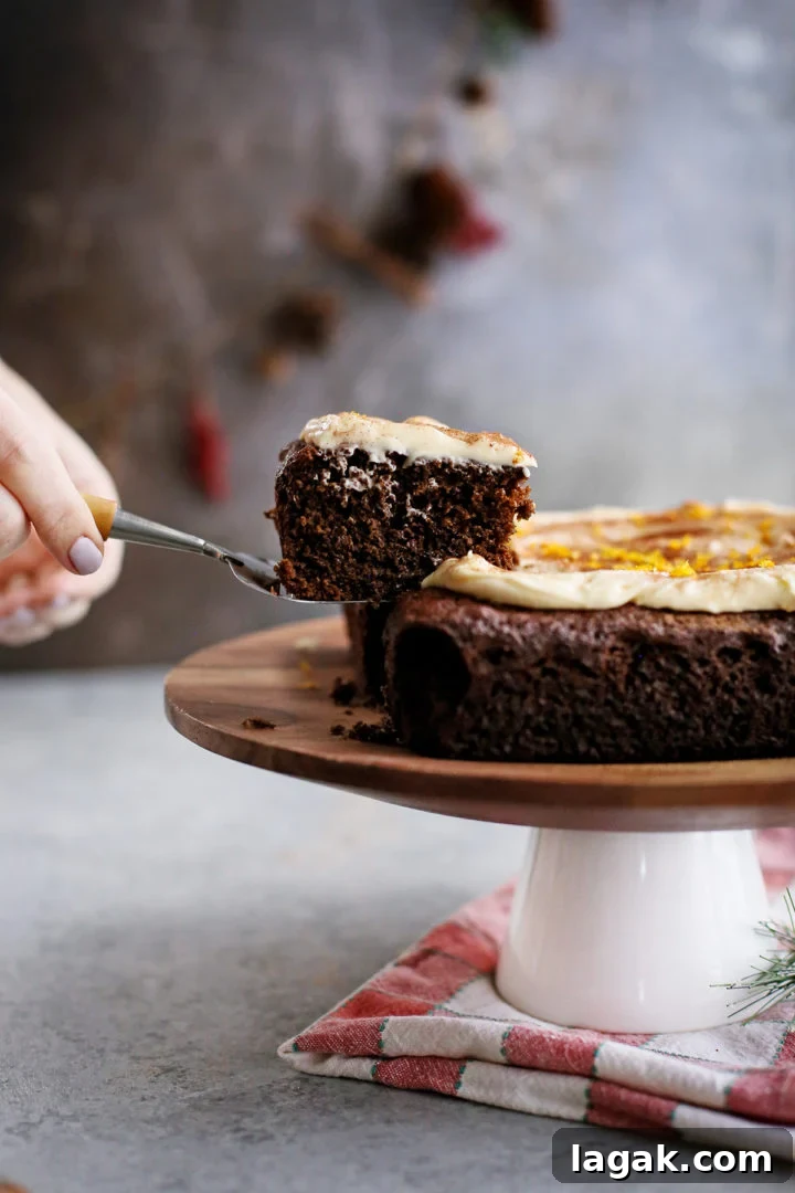 Chocolate Gingerbread Cake Recipe — Moist & Rich Flavor 7 photo of a woman serving this chocolate gingerbread cake recipe