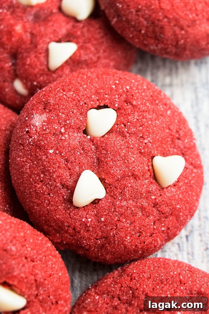 Red Velvet Cake Mix Cookies – Quick Moist Red Velvet Treats 3 Easy Homemade Red Cookies With White Chocolate Chips on Rustic Gray Background- Closeup Shot