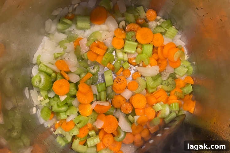 Instant Pot Rotisserie Chicken Soup Recipe for Comforting Meals 5 sauté onions, carrots and celery in instant pot