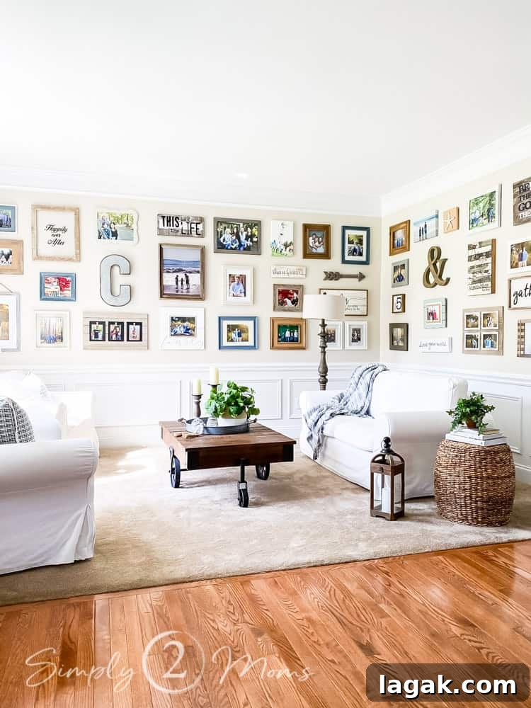 gallery walls on two walls in living room loveseat coffee table in front of walls filled with photos and artwork