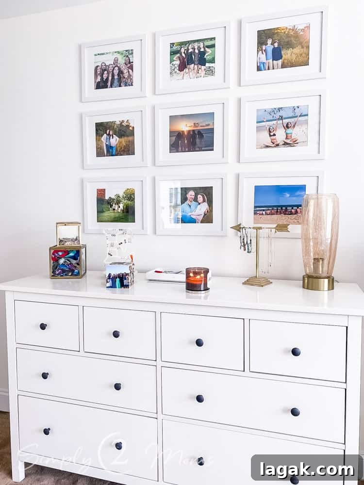 gallery wall of 9 picture frames hung over dresser in bedroom
