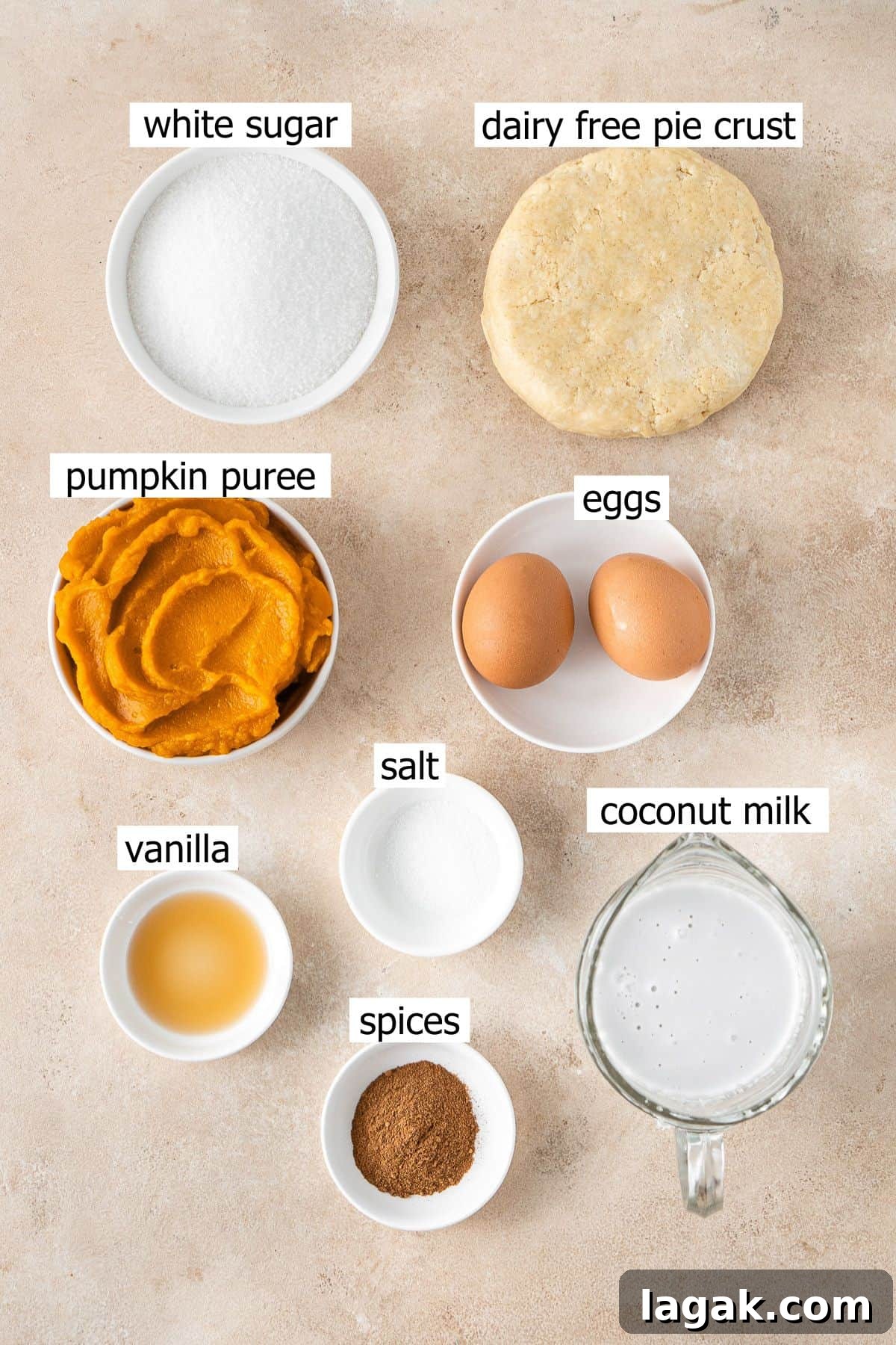 Creamy Dairy-Free Pumpkin Pie Recipe for Fall Celebrations 3 All ingredients needed to make a dairy free pumpkin pie laid out in small bowls.