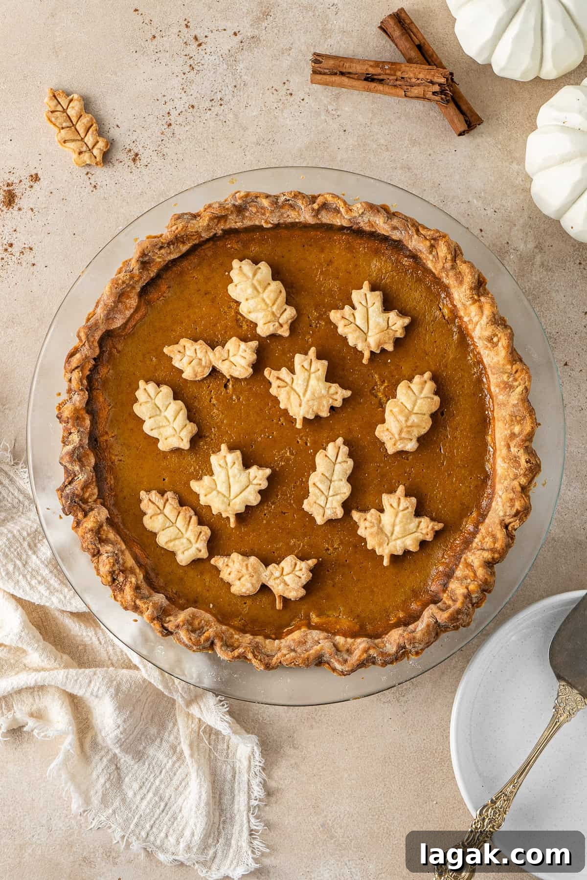 Creamy Dairy-Free Pumpkin Pie Recipe for Fall Celebrations 4 The finished baked dairy free pumpkin pie with pie crust leaves to decorate.
